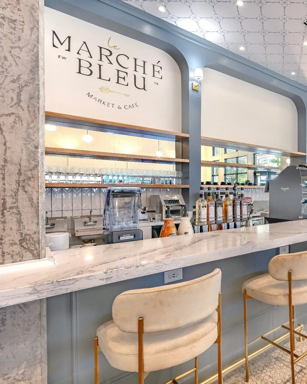 The marble coffee bar inside Le Marché Bleu